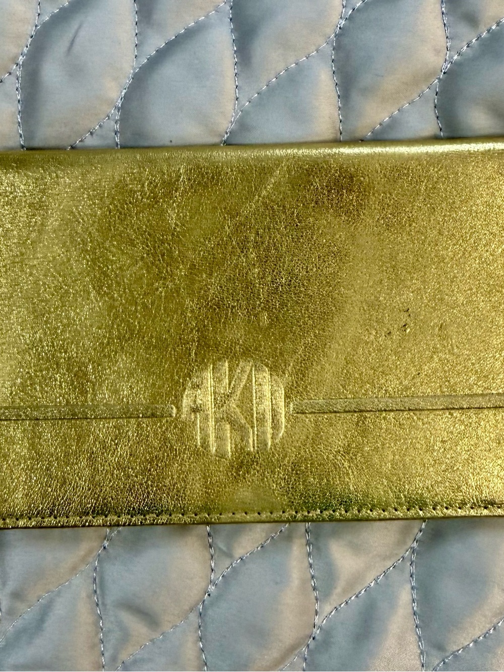 Metallic Gold Phone Wallet Case with Embossed Monogram Detail